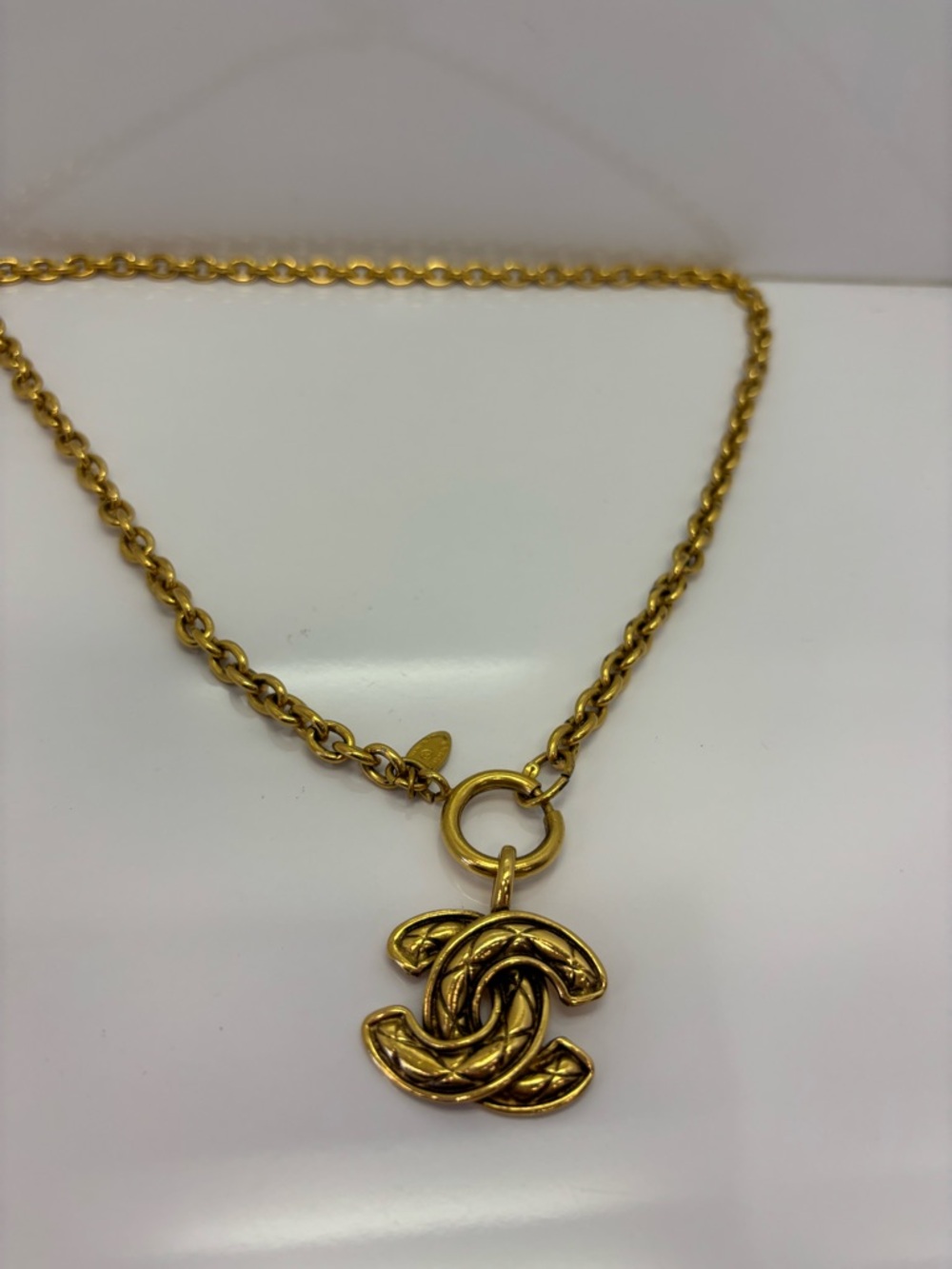 CHANEL Vintage quilted CC Necklace with Interlocking Logo Pendant